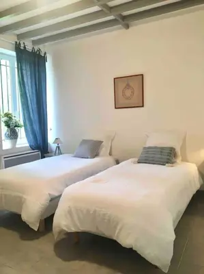 Un ou plusieurs lits dans un hébergement de l'établissement Cottage de charme à la campagne