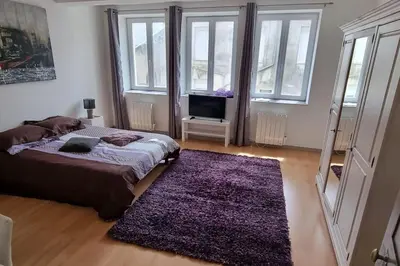 Un ou plusieurs lits dans un hébergement de l'établissement Maison de charme