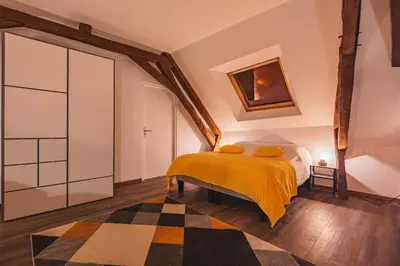 Un ou plusieurs lits dans un hébergement de l'établissement Le Logis du Marquis Jacuzzi Billard