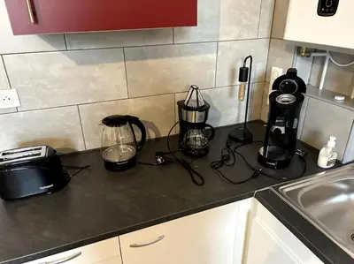 Cuisine ou kitchenette dans l'établissement Bienvenue au Quai 27