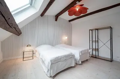 Un ou plusieurs lits dans un hébergement de l'établissement Les Mansardes : Duplex champenois typique et cosy