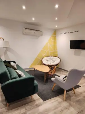 Coin salon dans l'établissement Appartement avec baignoire - Hautvillers