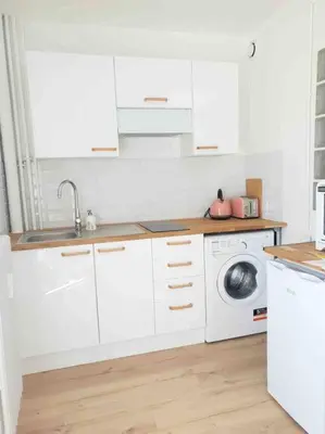 Cuisine ou kitchenette dans l'établissement Le Cosy du Faux Bourg