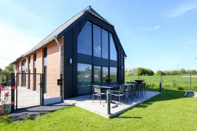 Jardin de l'établissement Un nid dans la Grange - Maison avec jacuzzi et sauna