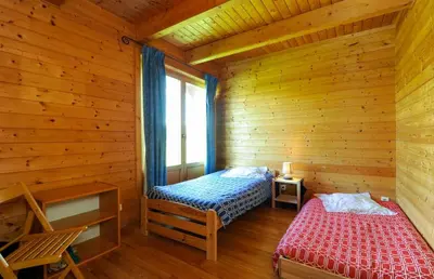 Un ou plusieurs lits dans un hébergement de l'établissement Le chalet dans la prairie