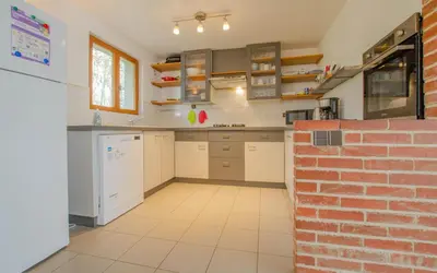 Cuisine ou kitchenette dans l'établissement La ferme du chateau
