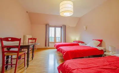 Un ou plusieurs lits dans un hébergement de l'établissement La ferme du chateau