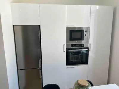 Cuisine ou kitchenette dans l'établissement COSY T3 Centre Reims/Pkg Privé