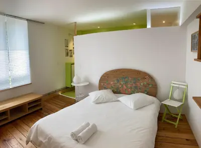 Un ou plusieurs lits dans un hébergement de l'établissement CHAMBRES D'HÔTES LA MADELEINE