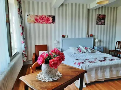 Un ou plusieurs lits dans un hébergement de l'établissement Le chateau