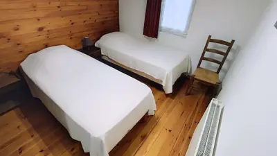 Un ou plusieurs lits dans un hébergement de l'établissement Le chalet du mazagran