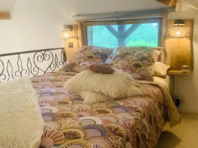 Un ou plusieurs lits dans un hébergement de l'établissement Chalet La Bohème