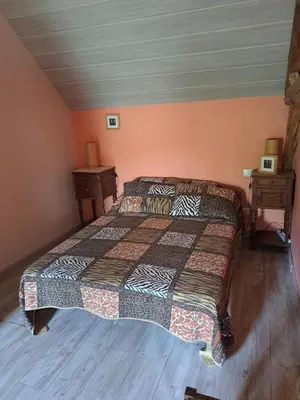 Un ou plusieurs lits dans un hébergement de l'établissement La Hulottière-Gîte La Grange
