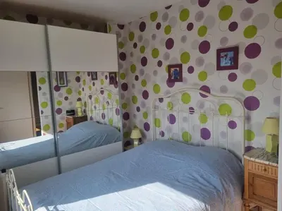 Un ou plusieurs lits dans un hébergement de l'établissement Le Haut du Theux - Gîte de vacances