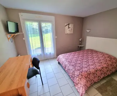 Un ou plusieurs lits dans un hébergement de l'établissement Auberge de la Forêt