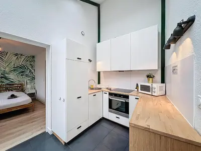 Cuisine ou kitchenette dans l'établissement Le Forum - HYPER centre - PARKING