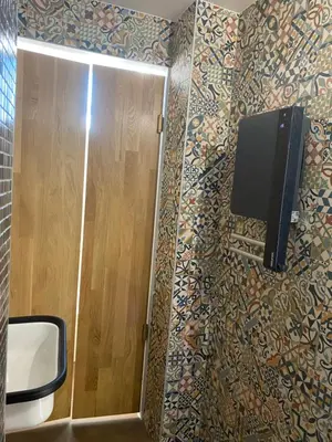 Télévision ou salle de divertissement dans l'établissement Duplex hammam au pied de la Cathédrale avec vue