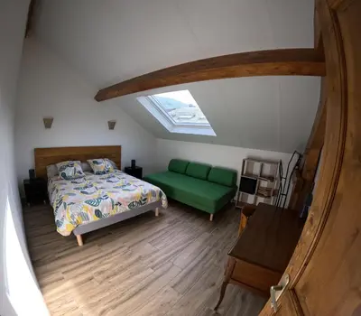 Un ou plusieurs lits dans un hébergement de l'établissement Gîte des quatre saisons