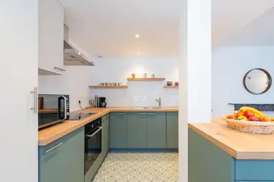 Cuisine ou kitchenette dans l'établissement Appartement Meuse & Mono, en hyper centre