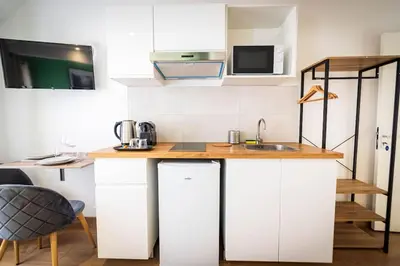 Cuisine ou kitchenette dans l'établissement L'Albatros 003- Hypercentre * Cosy * Wifi