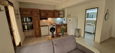 Cuisine ou kitchenette dans l'établissement Maison charmante climatisée avec aire de jeu à 35 minutes de Disneyland Paris