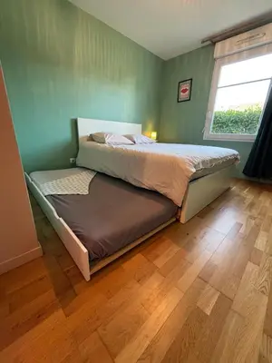 Un ou plusieurs lits dans un hébergement de l'établissement Be My Guest - Proche Disneyland Paris