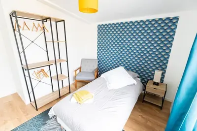 Un ou plusieurs lits dans un hébergement de l'établissement Gîte d'Artagnan 3 chambres