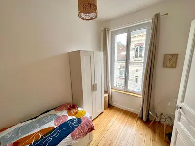 Un ou plusieurs lits dans un hébergement de l'établissement Appartement entier en plein coeur du centre ville