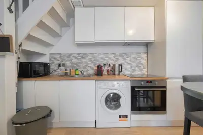 Cuisine ou kitchenette dans l'établissement Triplex cosy