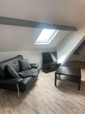 Coin salon dans l'établissement Superbe loft neuf - 1 chambre- face au Château - RIMBAUD