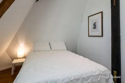 Un ou plusieurs lits dans un hébergement de l'établissement Suite Mana - Maui - Grand Loft en duplex avec Vue sur Place Ducale Parking inclus