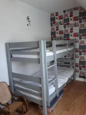 Un ou plusieurs lits dans un hébergement de l'établissement Chambres d'hôtes chez particulier