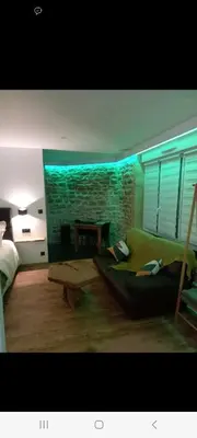 Coin salon dans l'établissement Romantique room