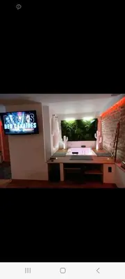 Télévision ou salle de divertissement dans l'établissement Romantique room