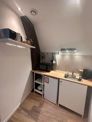 Cuisine ou kitchenette dans l'établissement Le Petit Port - La Belle Etoile