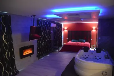 Un ou plusieurs lits dans un hébergement de l'établissement Love Room insolite Erotika