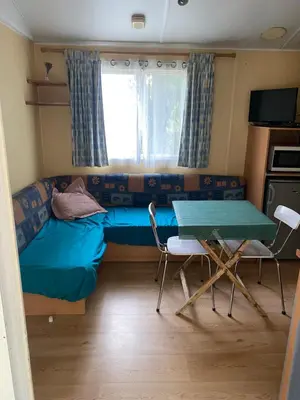 Coin salon dans l'établissement Mobil-Home standard