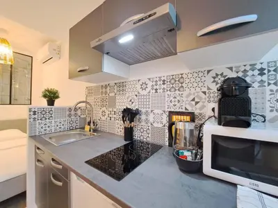 Cuisine ou kitchenette dans l'établissement Maputo - Appartement climatisé