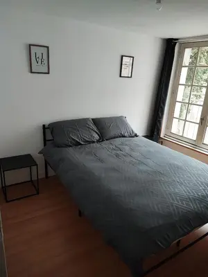 Un ou plusieurs lits dans un hébergement de l'établissement Maison 2 chambres Centre-Ville