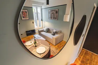 Un ou plusieurs lits dans un hébergement de l'établissement Art Déco Lesage & Spa
