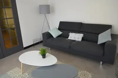 Coin salon dans l'établissement Agréable maison petit jardin à 7 minutes de Reims
