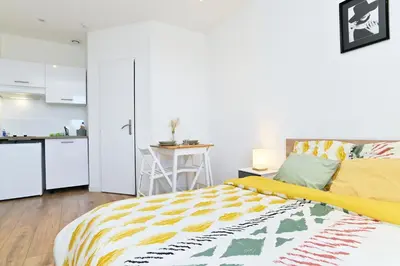 Un ou plusieurs lits dans un hébergement de l'établissement TC Residences - Charmant Appartement