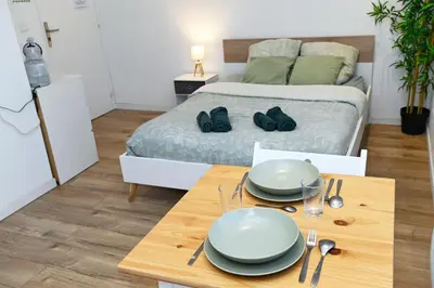 Un ou plusieurs lits dans un hébergement de l'établissement TC Residences - Charmant Appartement