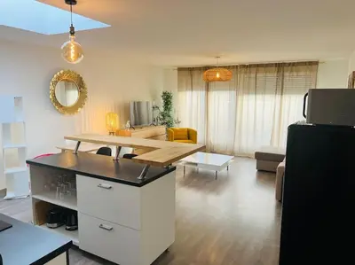 Coin salon dans l'établissement Harmonieux/Bezannes/Pkg Privé