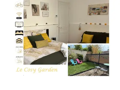 Un ou plusieurs lits dans un hébergement de l'établissement Au Cosy Garden
