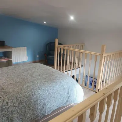 Un ou plusieurs lits dans un hébergement de l'établissement Loft entier, calme, fibre et wifi