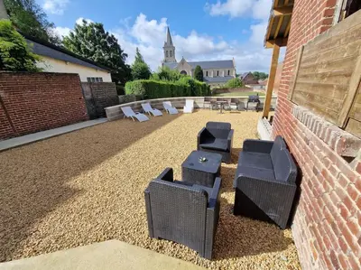 Coin salon dans l'établissement Maison avec cours privative
