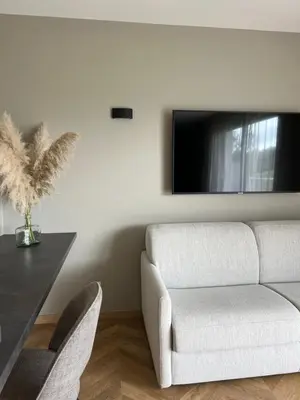 Télévision ou salle de divertissement dans l'établissement Le Clos des Huy Prés
