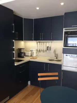 Cuisine ou kitchenette dans l'établissement Le Clos Voltaire