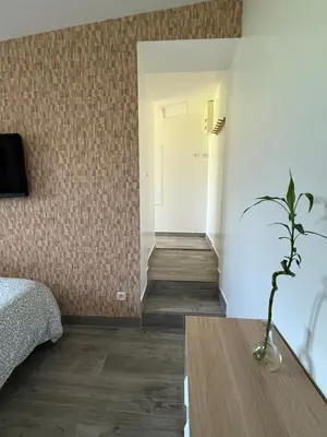 Un ou plusieurs lits dans un hébergement de l'établissement Studio meublé marne la vallée / Disneyland